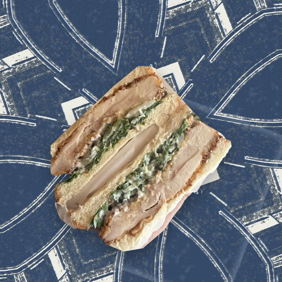 The Chicken Piccata, photographed in cross-section and floated over a riso print of the Austin skyline.