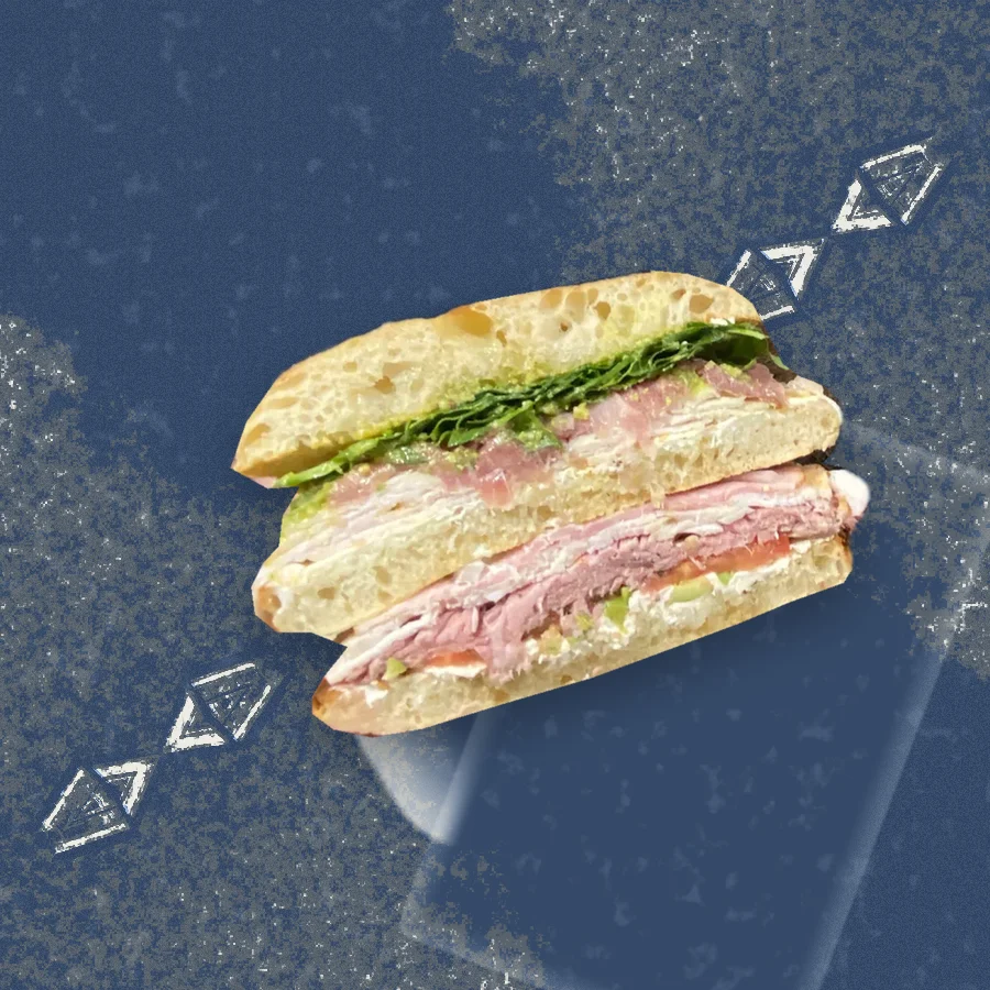 The Club Sandwich, photographed in cross-section and floated over a riso print of the Austin skyline.