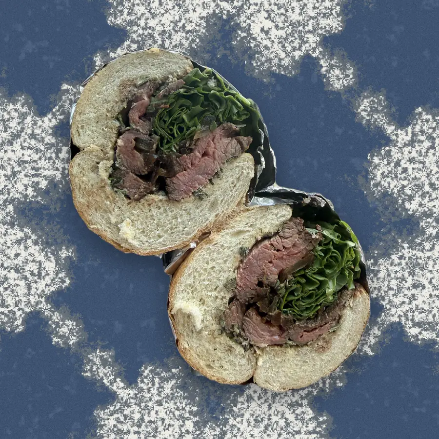 The Steak Sandwich, photographed in cross-section and floated over a riso print of the Austin skyline.